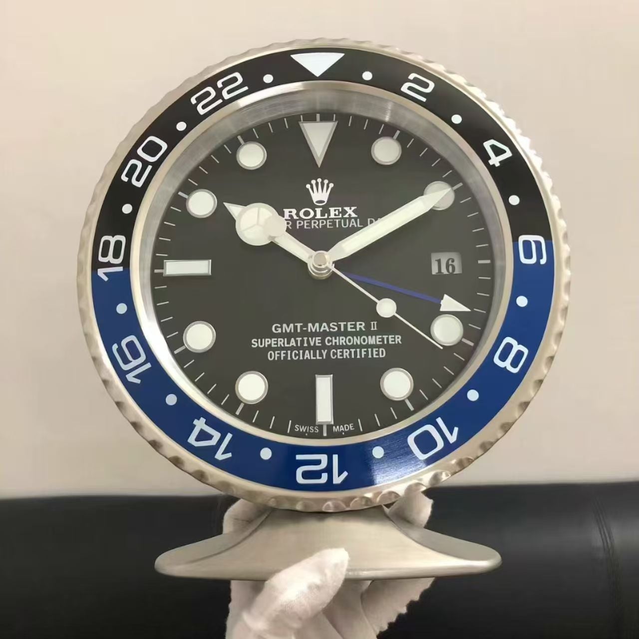 WT-2116 GMT Desk - Freestanding GMT-style desk clock with two-tone black and blue bezel and brushed steel case on display stand - luxury collector's piece for office desks and showroom displays. | Boto Clock wholesale manufacturer